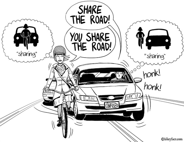 Cyclist getting asked by a car drive to share some road space