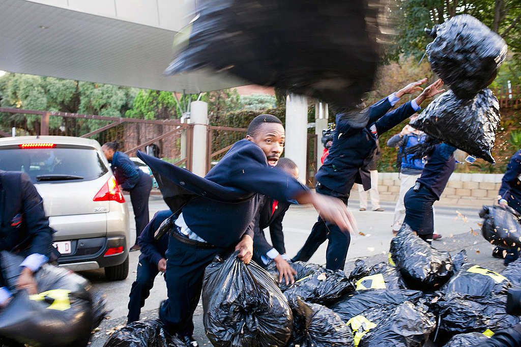 Action Outside IDC In Johannesburg. © Shayne Robinson / Greenpeace