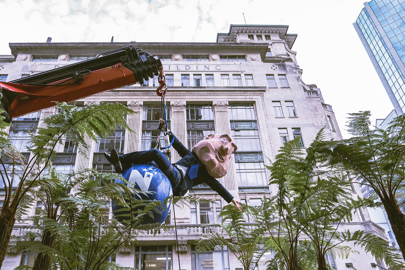A Prime Minister Christopher Luxon lookalike has been swinging through Auckland atop a National Party-blue wrecking ball to promote the March for Nature protest on 8 June.