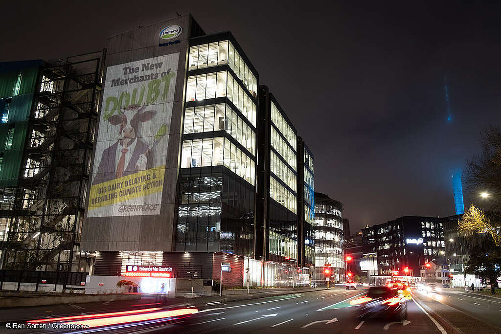 Greenpeace Aotearoa project a giant image on to the side of the Fonterra HQ in Auckland, New Zealand that reads “The New Merchants of Doubt - Big dairy delaying and derailing climate action. Greenpeace Aotearoa project a giant image on to the side of the Fonterra HQ in Auckland, New Zealand that reads “The New Merchants of Doubt - Big dairy delaying and derailing climate action.