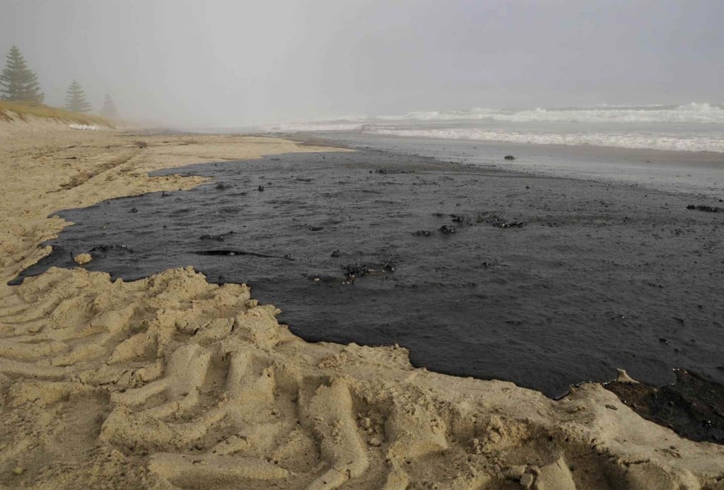 Oil covers a section of Papamoa beach. It comes from the Rena, a container ship which ran aground the Astrolab Reef, about 20km from Tauranga on October 5th. Greenpeace New Zealand is campaigning against deep sea oil drilling off New Zealand's coasts, on the basis that such activity could well lead to a far worse spill than that from the Rena. The setting up of the final frontiers in oil exploration will also only make the climate crisis worse.