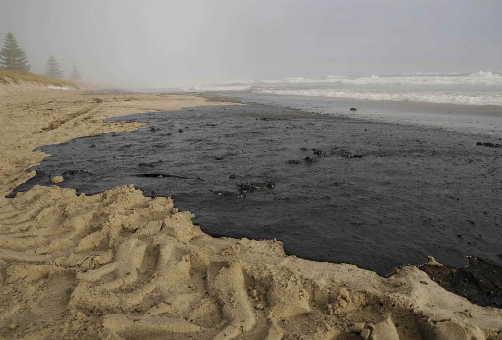 Oil covers a section of Papamoa beach. It comes from the Rena, a container ship which ran aground the Astrolab Reef, about 20km from Tauranga on October 5th. Greenpeace New Zealand is campaigning against deep sea oil drilling off New Zealand's coasts, on the basis that such activity could well lead to a far worse spill than that from the Rena. The setting up of the final frontiers in oil exploration will also only make the climate crisis worse.