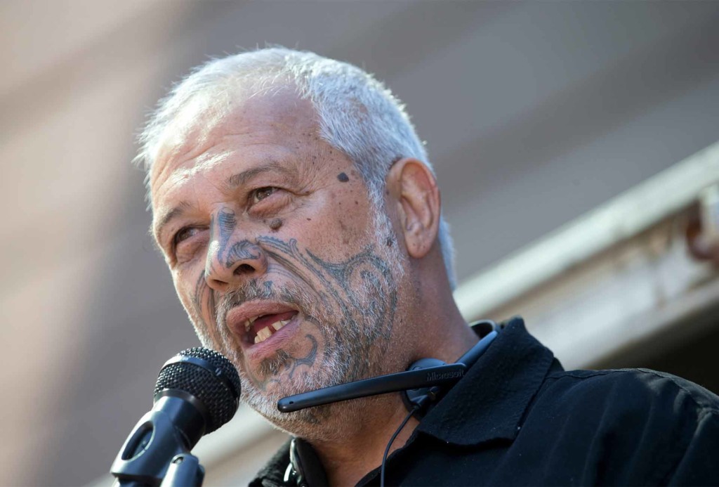 One of the organisers of the Waiho Papa Moana hikoi (protest march) Mike Smith speaks to the crowd in Auckland.