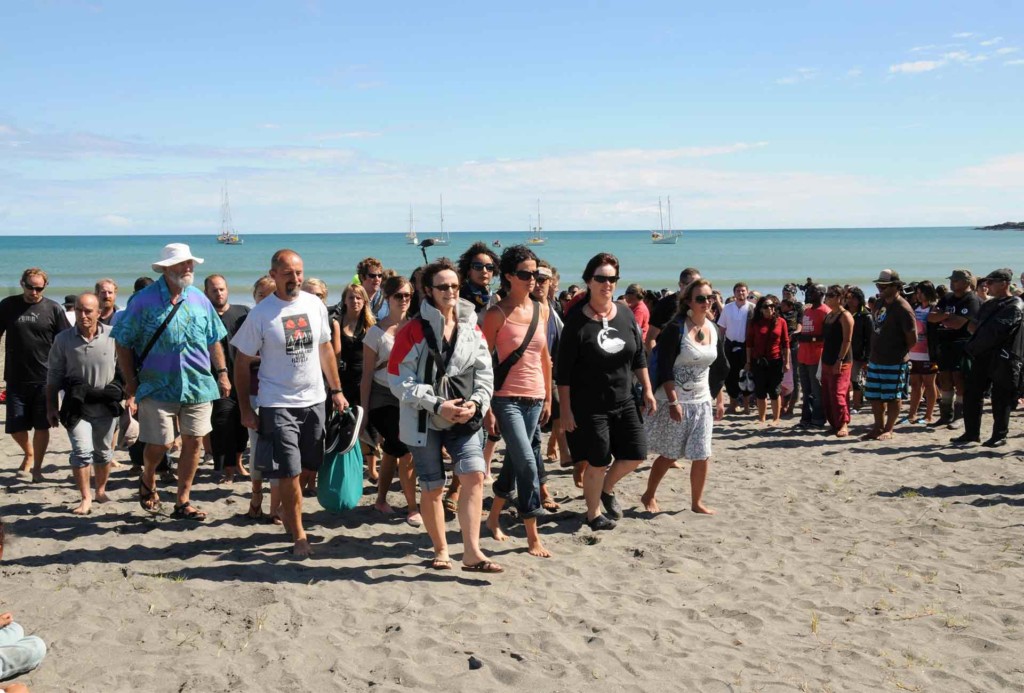 Skippers, crew and activists from the flotilla of five boats, which travelled from around the North Island, arrive at the hui in Whangaparaoa Bay. © Greenpeace / Malcolm Pullman