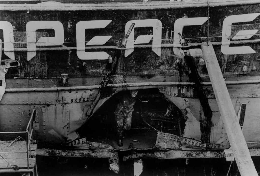 A gaping hole can be seen in the side of the Rainbow Warrior following the bombing by French secret service agents. © Keith Scott / Truth / Greenpeace