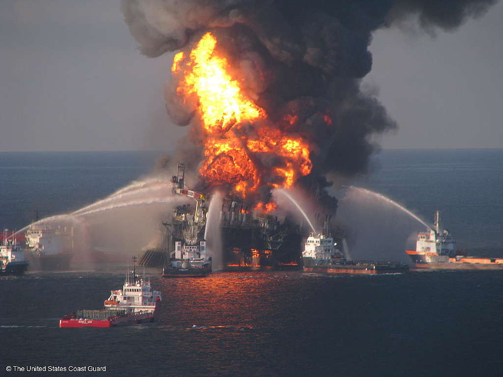 Fire boat response crews battle the blazing remnants of the off shore oil rig Deepwater Horizon. Multiple United States Coast Guard helicopters, planes and cutters responded to rescue the BP Deepwater Horizon's 126 person crew. Eleven workers died and millions of barrels of crude oil gushed into the Gulf in worst oil spill in United States history.