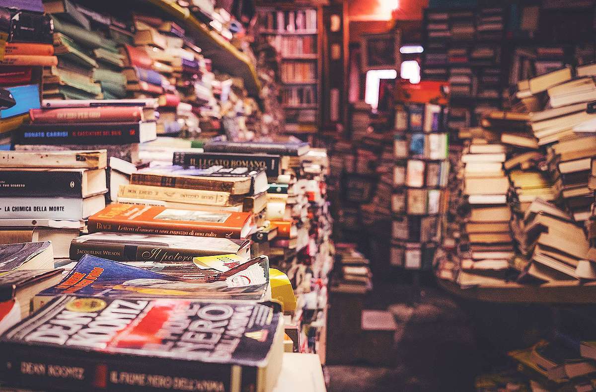 Image of stacked books illustrating coronavirus reading list