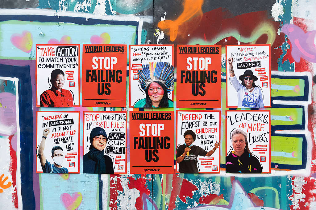 Posters featuring portraits of climate impacted people and activists and their messages to world leaders to tackle the climate and nature crisis. © Marie Jacquemin / Greenpeace