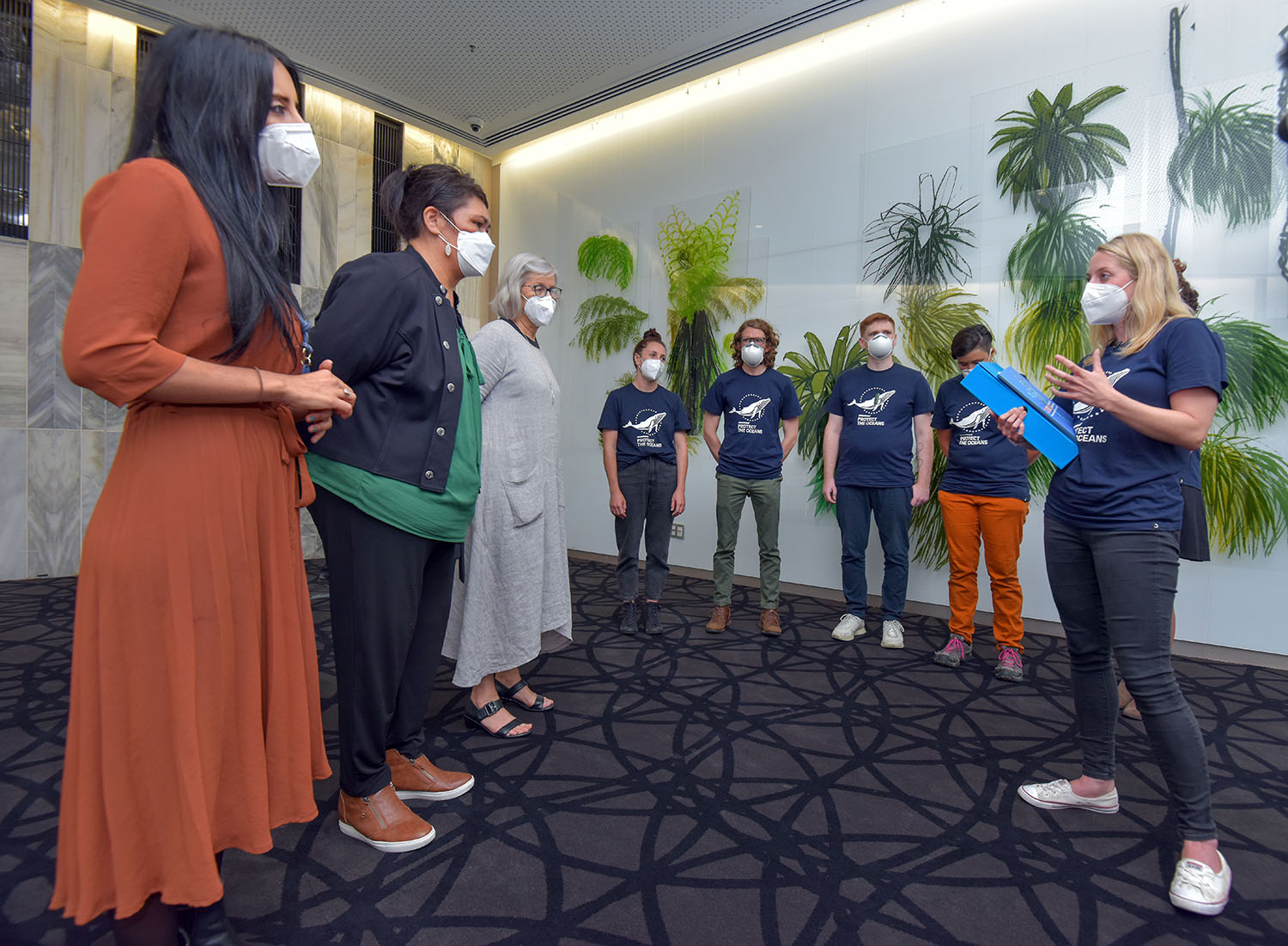From left, Green MP Golriz Ghahraman, Minister of Foreign Affairs Nanaia Mahuta and Green MP Eugenie Sage receive a Global Oceans Treaty petition from Greenpeace Aotearoa's Ellie Hooper (right) at NZ Parliament in Wellington, New Zealand on Wednesday, 9 February 2022.