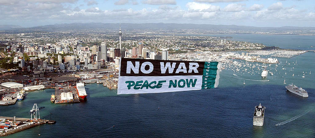 Greenpeace displays an 18 by 6 metre 'No War, Peace Now' banner above the opening of the America's Cup yacht challenge today as part of a global day of protest around the world. Up to 20,000 attended the peace rally in Auckland.