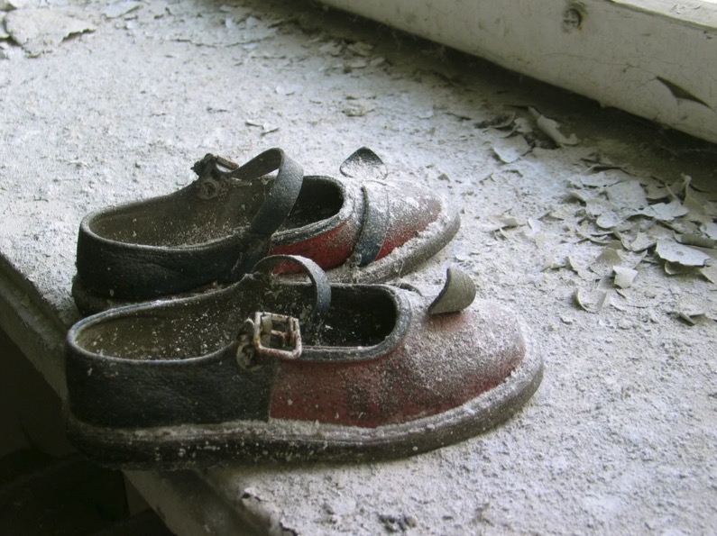 Abandoned baby shoes in a Pripyat kindergarten. © Vaclav Vasku / Greenpeace