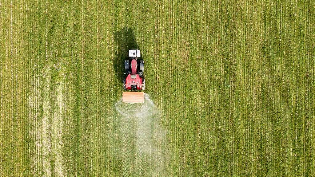 Birds eye view of a tractor spraying a ffield
