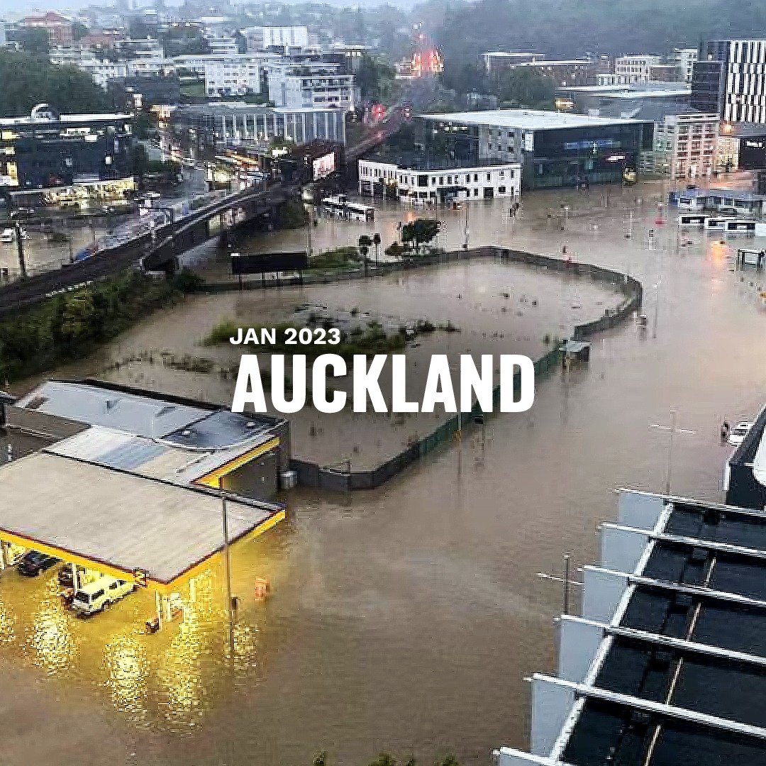 an urban area flooded with dirty water, title is Auckland 2023