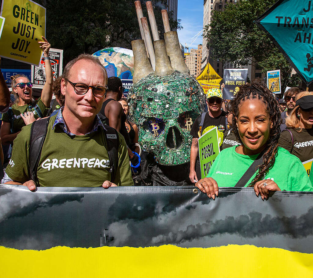 Greenpeace International Executive Director Mads Christensen, left, talks with Greenpeace US Executive Director Ebony Martin while carrying a banner in the march. Thousands gathered in New York City for the “March to End Fossil Fuels” in the lead up to the UN Climate Ambition Summit on September 20th. Protestors called on President Biden and global leaders to phase-out fossil fuels and jumpstart a fair and just transition to renewable energy.