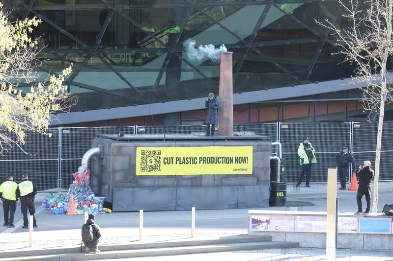 Greenpeace Canada activists delivered a 20-foot “Global Plastics Factory” to the doorstep of the Shaw Center, where the talks on a Global Plastics Treaty are taking place. The factory displayed oil being turned into plastic pollution and messages that read: "Cut plastic production now!" on each side. Hand-held banners reflected the same message in eight languages: Chinese, Filipino, French, German, Japanese, Spanish, Swahili and Thai. To highlight the urgency for delegates to take bold actions, Greenpeace wrote on top of the Factory: “The world is watching you!” Greenpeace Canada activists delivered a 20-foot “Global Plastics Factory” to the doorstep of the Shaw Center, where the talks on a Global Plastics Treaty are taking place. The factory displayed oil being turned into plastic pollution and messages that read: "Cut plastic production now!" on each side. Hand-held banners reflected the same message in eight languages: Chinese, Filipino, French, German, Japanese, Spanish, Swahili and Thai. To highlight the urgency for delegates to take bold actions, Greenpeace wrote on top of the Factory: “The world is watching you!”