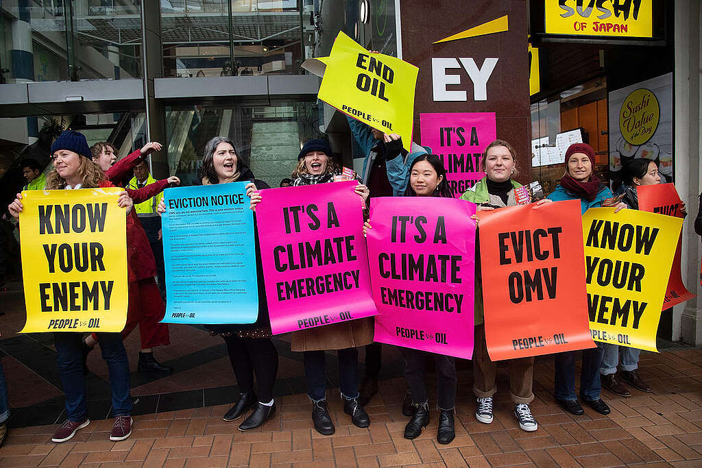 Activists hold placards reading "ITS A CLIMATE EMERGENCY", "EVICT OMV" and "KNOW YOUR ENEMY" outside Austrian Oil company OMV's office in Wellington. Activists hold placards reading "ITS A CLIMATE EMERGENCY", "EVICT OMV" and "KNOW YOUR ENEMY" outside Austrian Oil company OMV's office in Wellington.