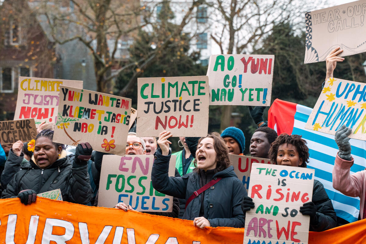 A powerful and diverse assembly of voices from around the globe gather in front of the Peace Palace in the Netherlands to demand climate justice. As the International Court of Justice prepares to begin its hearings on climate change and its impacts on human rights for current and future generations, this peaceful demonstration sets the stage for these historic discussions. © Emiel Hornman / Greenpeace