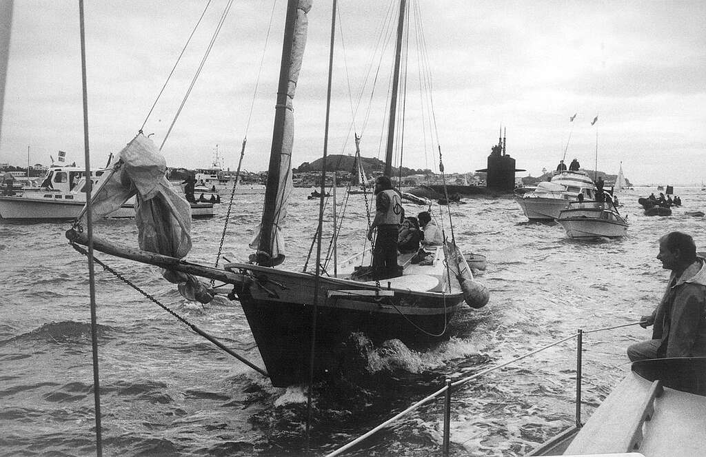 The USS Phoenix submarine is met by the Peace Squadron as it arrives in Waitemata harbour, Auckland on 9 November, 1983. The growing anti-nuclear movement in New Zealand was hostile to visits from US ships because the Americans refused to confirm or deny whether their ships carried nuclear weapons. Public opinion was increasingly in favour of banning these visits. Between 1978 and 1983 opposition to nuclear-armed ship visits rose from 32% to 72%. In 1985 the Government effectively banned nuclear ship visits. New Zealand was the first country to declare itself nuclear free when it passed legislation in 1987. The USS Phoenix submarine is met by the Peace Squadron as it arrives in Waitemata harbour, Auckland on 9 November, 1983. The growing anti-nuclear movement in New Zealand was hostile to visits from US ships because the Americans refused to confirm or deny whether their ships carried nuclear weapons. Public opinion was increasingly in favour of banning these visits. Between 1978 and 1983 opposition to nuclear-armed ship visits rose from 32% to 72%. In 1985 the Government effectively banned nuclear ship visits. New Zealand was the first country to declare itself nuclear free when it passed legislation in 1987.