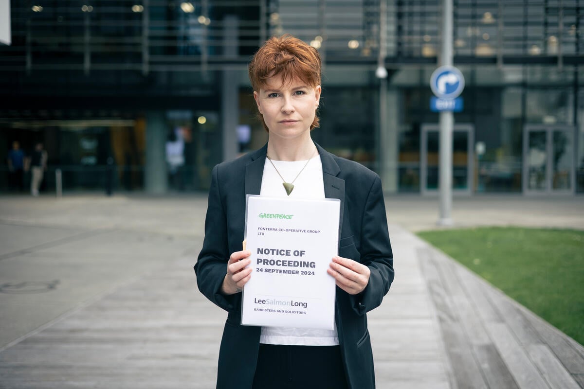 Activists Served  Legal Notice against Fonterra in Auckland. © Bryce Groves / Greenpeace