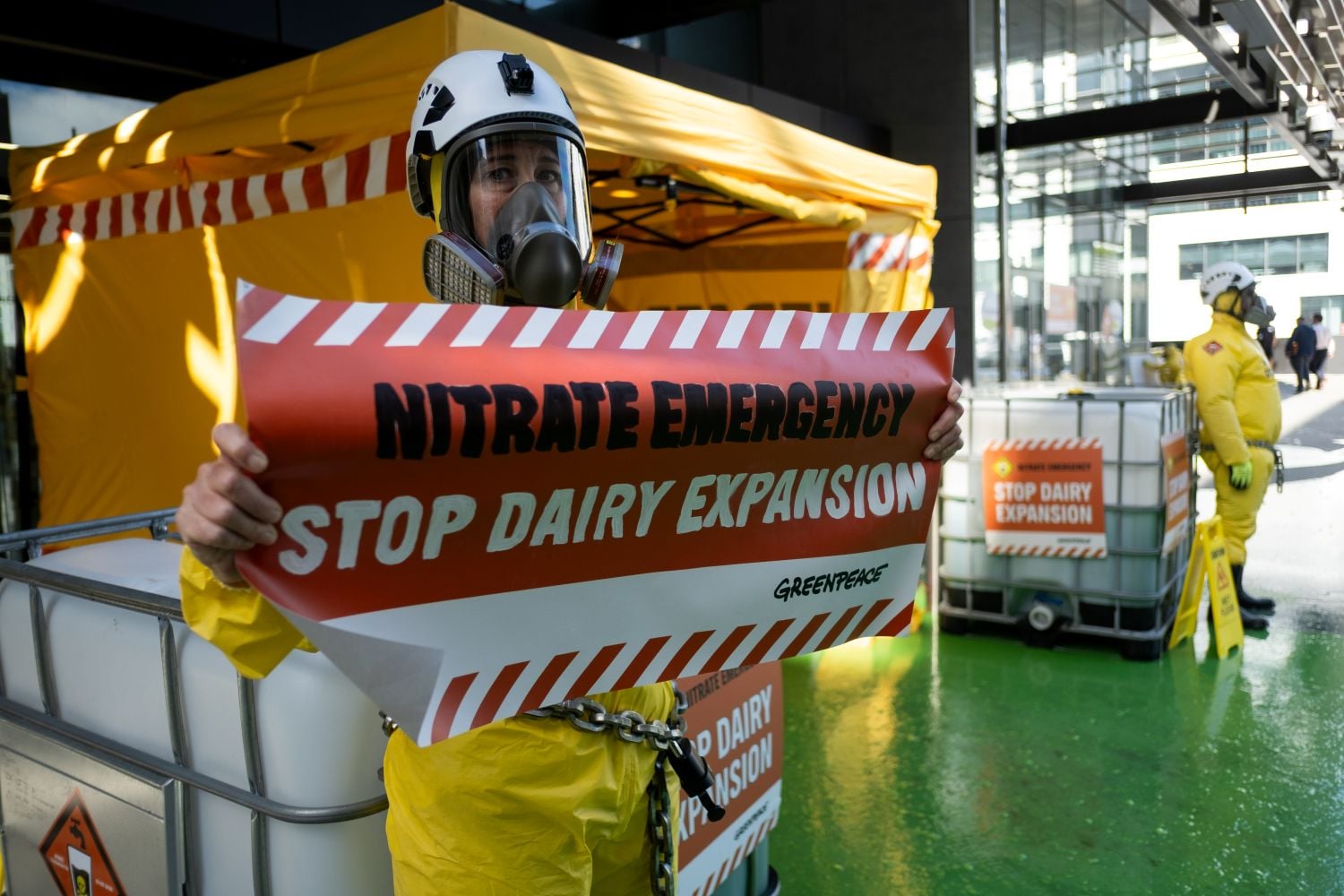 Three Greenpeace activists removed by police from Fonterra nitrate pollution protest during shareholder meeting