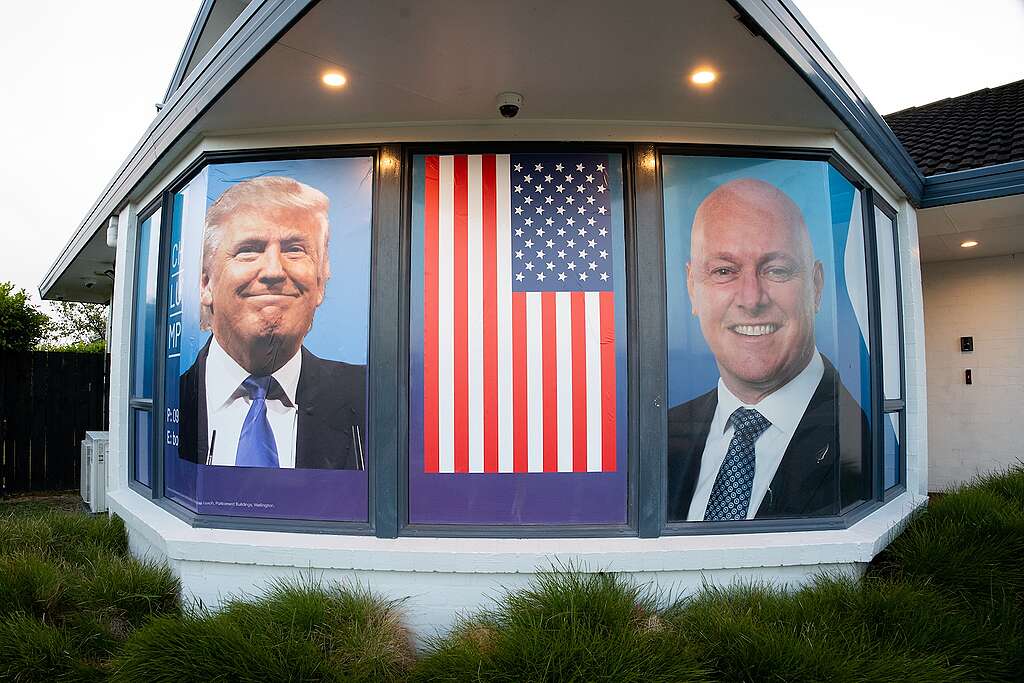 The images of Donald Trump and PM Christopher Luxon on windows with a US flag between them