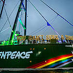 The Rainbow Warrior is lit up as a “beacon of resistance” in Auckland today on the eve of the 40th anniversary of the bombing of the original Rainbow Warrior by French Government agents in 1985.
Twenty crew and Greenpeace Aotearoa staff and volunteers hold letters of light spelling out the iconic phrase, You Can’t Sink A Rainbow.