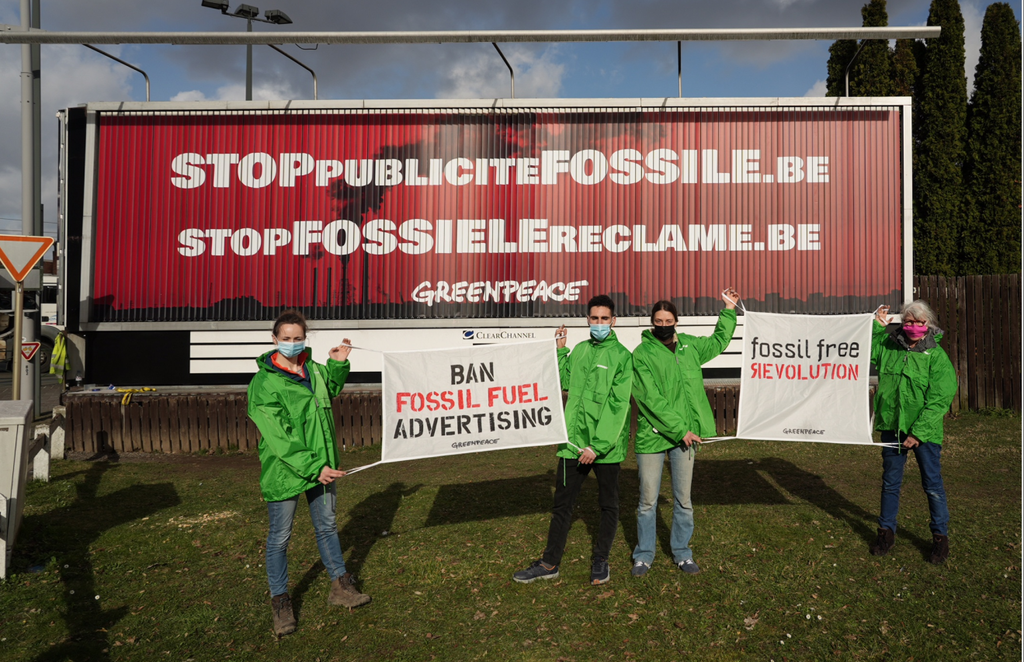 Ad busting fossil car ad in Brussels Ad busting fossil car ad in Brussels