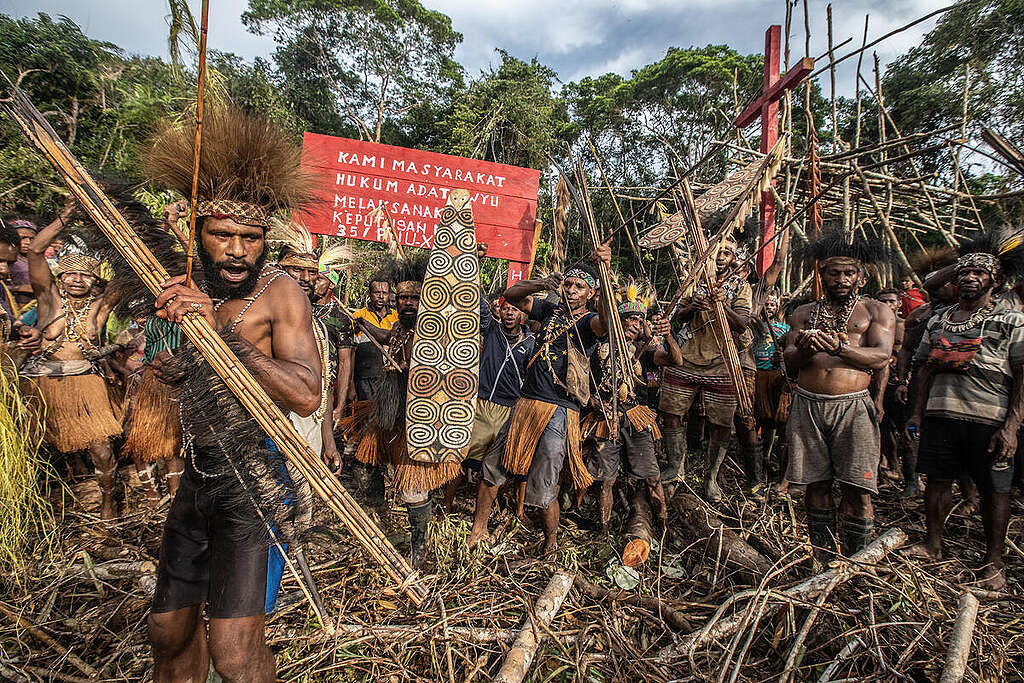 Indigenous Papuan people of Awyu gather during a ceremony of installing cross sign in Kowo village, Boven Digoel, South Papua.