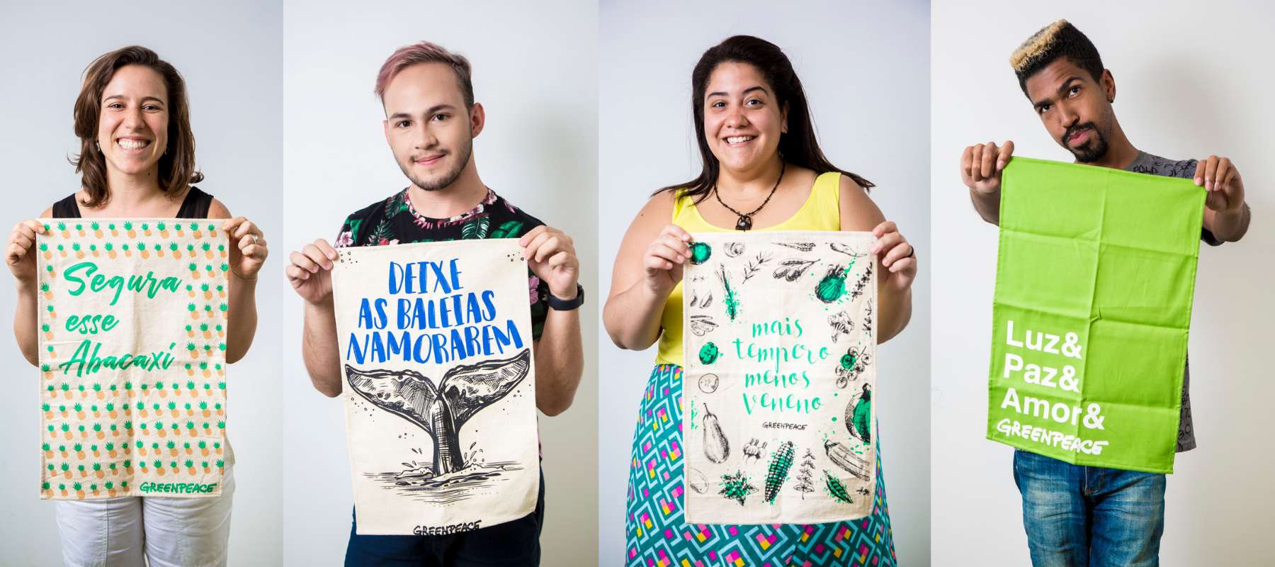 Imagem das pessoas do time do Greenpeace Brasil segurando o pano de prato "Por um mundo verde e justo"