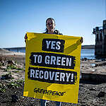 Protest with banner on the banks of the Kakhovka reservoir in Zaporizhzhia city. 
After Russian military forces destroyed the Kakhovka, the massive Kakhovka reservoir at over 2,144 square km flooded downstream. The reservoir is the principal source of cooling water for the Zaporizhzhia nuclear plant - the plant has been under occupation by Rosatom - the Russian State Nuclear Corporation, and Russian armed forces.
Banner reads "Yes to Green Recovery".