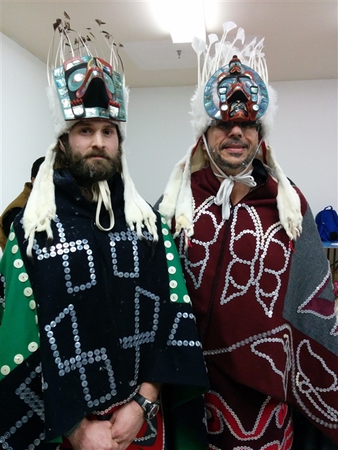 Greenpeace staff Mark Worthing and Eduardo Sousa, in Kwakwaka'wakw regalia preparing for Peace Dance, Willie Family Potlatch and Greenpeace Sisiutl Renewal Ceremony March 2015