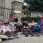 Children’s shoes were placed in front of a church in Kahnawake, in memory of the 215 children whose remains were found in a mass grave at a residential school in Kamloops, British Columbia. (Chloe Ranaldi/CBC)