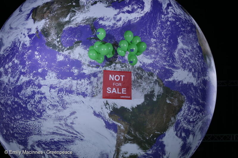 Planet with a banner reading “NOT FOR SALE” 