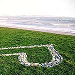Greenpeace UK volunteers in Penzance, Newlyn Beach, create a giant heart, as part of the Climate Coalition’s annual 'Show the Love' campaign, which shows what people love and don’t want to lose to climate change. Volunteers also carry out a community clean up activity, collecting bags of rubbish.