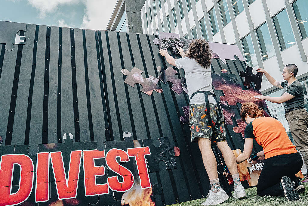 In 2024, Greenpeace activists protested during an investors meeting at the company’s headquarters in Auckland. Activists put together a puzzle that exposed the cost of Fonterra’s use of palm kernel for the rainforest in Southeast Asia.