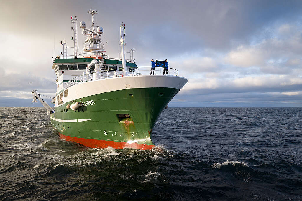 Dr. Sandra Sch&ouml;ttner, Greenpeace Science Lead, and Daniel Bengtsson, Communication Lead of the expedition, on the bow of the Deep Arctic Expedition research vessel in the Norwegian Sea.