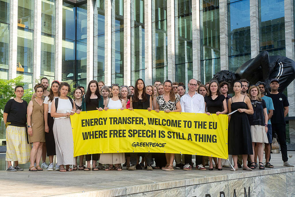 People gathered outside the New Amsterdam Courthouse in July 2025 to mark the beginning of Greenpeace International's anti-SLAPP lawsuit against Energy Transfer.