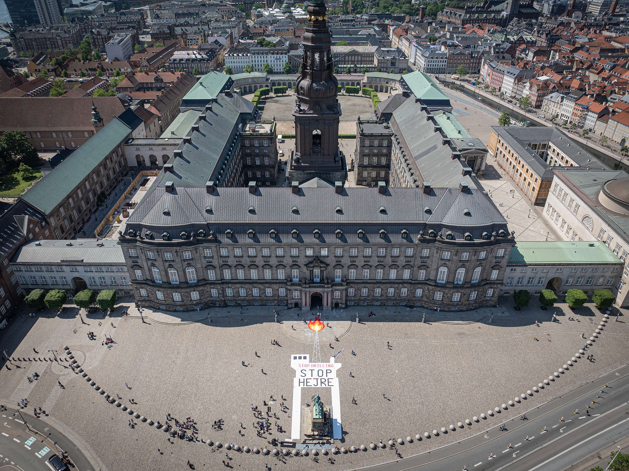Greenpeace together with Fossil Free Future ( Fossilfri Fremmtid ) demonstrate against the Danish government's plans to open the Hejre field in the North Sea for oil exploitation. The group lay out a banner in the shape of an oil rig with the words ‘Stop Drilling, Stop Hejre’, in front of the Danish parliament building, Christiansborg, in central Copenhagen.