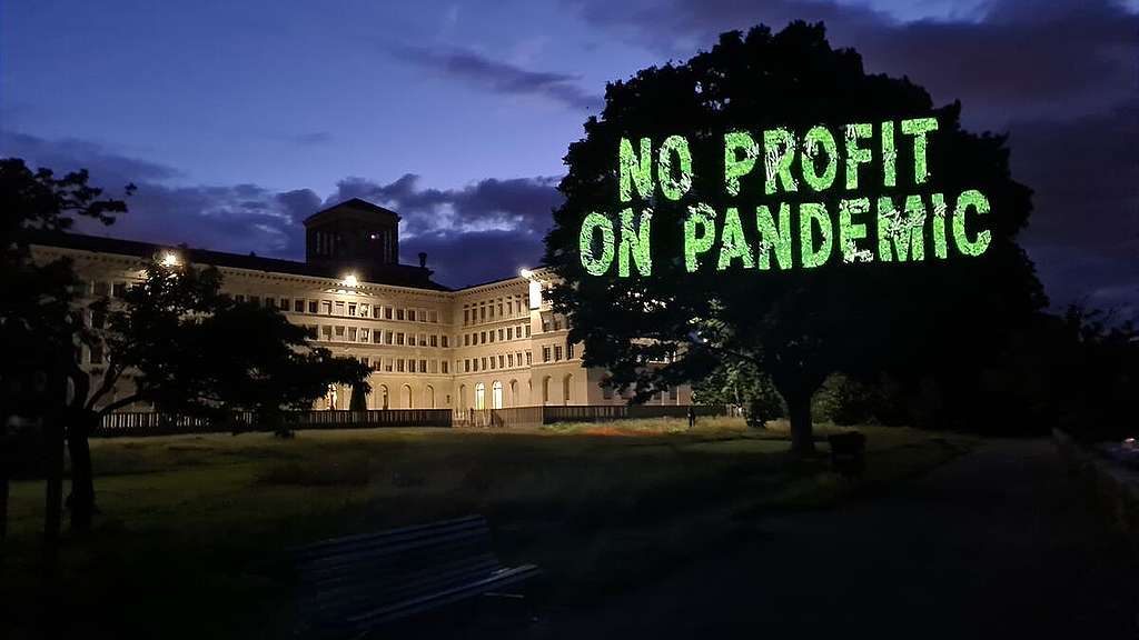 Vaccine Projection at WTO in Geneva. © Maxime Sauvant / Greenpeace