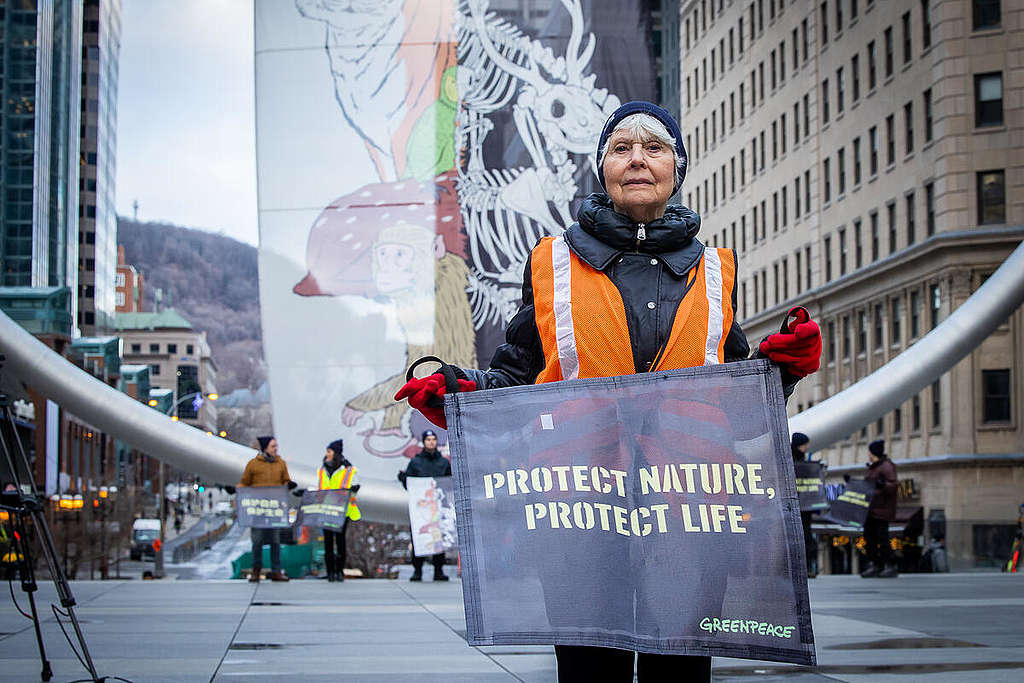 Banner at Montreal’s l’Anneau as COP15 Begins.