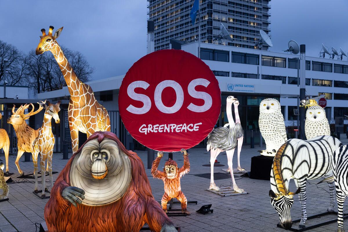 Protest with Luminous Animal Figures for Protecting Nature in front of UN Building in Bonn.