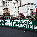 Climate Activists with banners and flags at the Palestine Solidarity March in London.