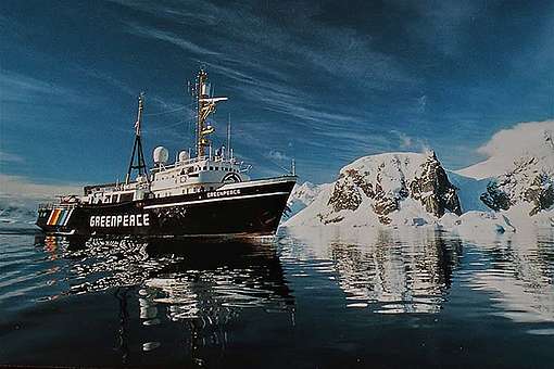 September 1992 Postcard of the ice-class vessel MV Greenpeace on patrol in Antarctica