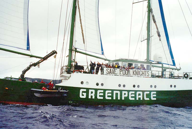 7 June 1996: Greenpeace’s flagship SV Rainbow Warrior II sails from Whangarei to the Poor Knights Islands campaign for a ban on all fishing around the Poor Knights Islands, seen here with a 'Save Poor Knights' banner. Photo by Michael Szabo.jpg