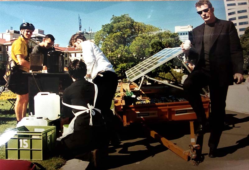 13 November 1997 Greenpeace Climate Campaigner Adam Laidlaw drinking a coffee from the Solar Café Greenpeace set up outside Parliament