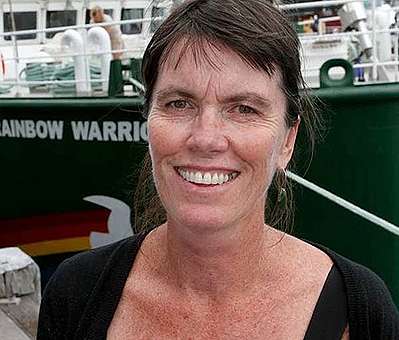 Bunny McDiarmid standing by SV Rainbow Warrior II