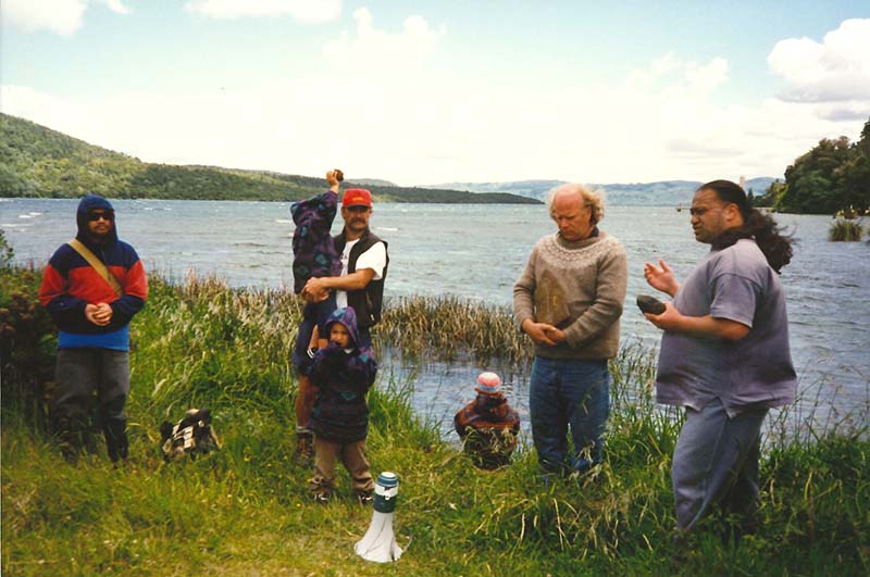 22 November 1996: Greenpeace joins Te Tatau Pounamu O Te Awa O Te Atua (The Greenstone Door to the River of the Gods) for a Hikoi or sacred journey along the Tarawera River. One of the highlights was a blessing ceremony to lay sacred stones at the source of the river in Lake Tarawera to help restore its Mauri (life-force). Pouroto Ngaropo of Ngati Awa led a karakia before the stones were placed in the river (at right). Pictured with him are Gordon Jackman (Greenpeace), Tipene Marr (Ngati Rangitihi) Tairua Whakaruru (Tuwharetoa ki Kawarau). Photo: Michael Szabo
