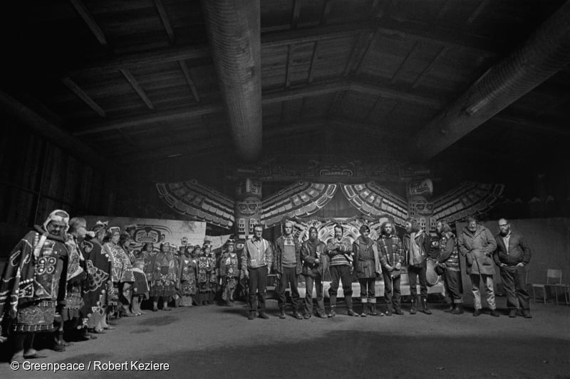 Greenpeace crew visit the Kwakwaka’wakw Peoples of Alert Bay ('Yalis) in the Indigenous territory of the Namgis First Nation, on the west coast of British Columbia, Canada. The crew members are in the traditional Big House and were given regalia to wear and blessed with water and eagle feathers. This special ceremony was a huge honour and their way of thanking and protecting the crew from harm on their first Greenpeace campaign. This is a photographic record by Robert Keziere of the very first Greenpeace voyage, which departed Vancouver on the 15th September 1971. The aim of the trip was to halt nuclear tests in Amchitka Island by sailing into the restricted area.  The crew on-board the ship, are the pioneers of the green movement who formed the original group that became Greenpeace.