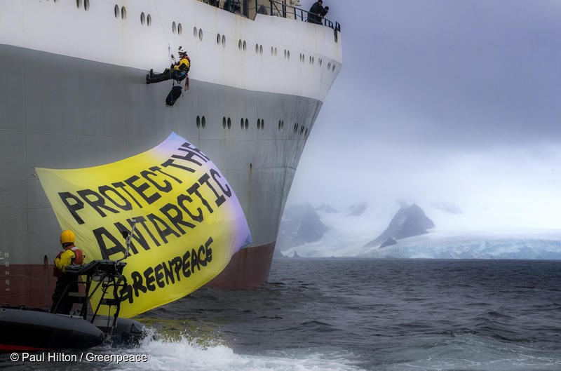 Greenpeace activists in peaceful protest, displaying a banner saying “Protect the Antarctic” on the Ukrainian krill trawler 'More Sodruzhestva' in the Bransfield Strait near Greenwich Island, Antarctic, 22nd Marech 2018. Greenpeace is calling for the krill industry to commit to stop fishing in any area being considered by governments for ocean sanctuary status, and to back proposals for marine protection in the Antarctic. Photo: Paul Hilton / Greenpeace 