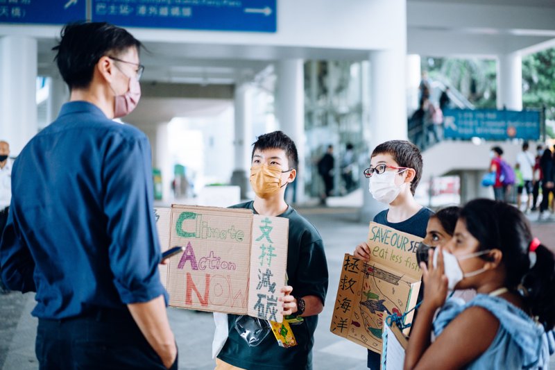 Max(中)和Ennan(右三)一起氣候行動接近3個月,慢慢適應與陌生人交流,少了羞怯。© Greenpeace / Patrick Cho